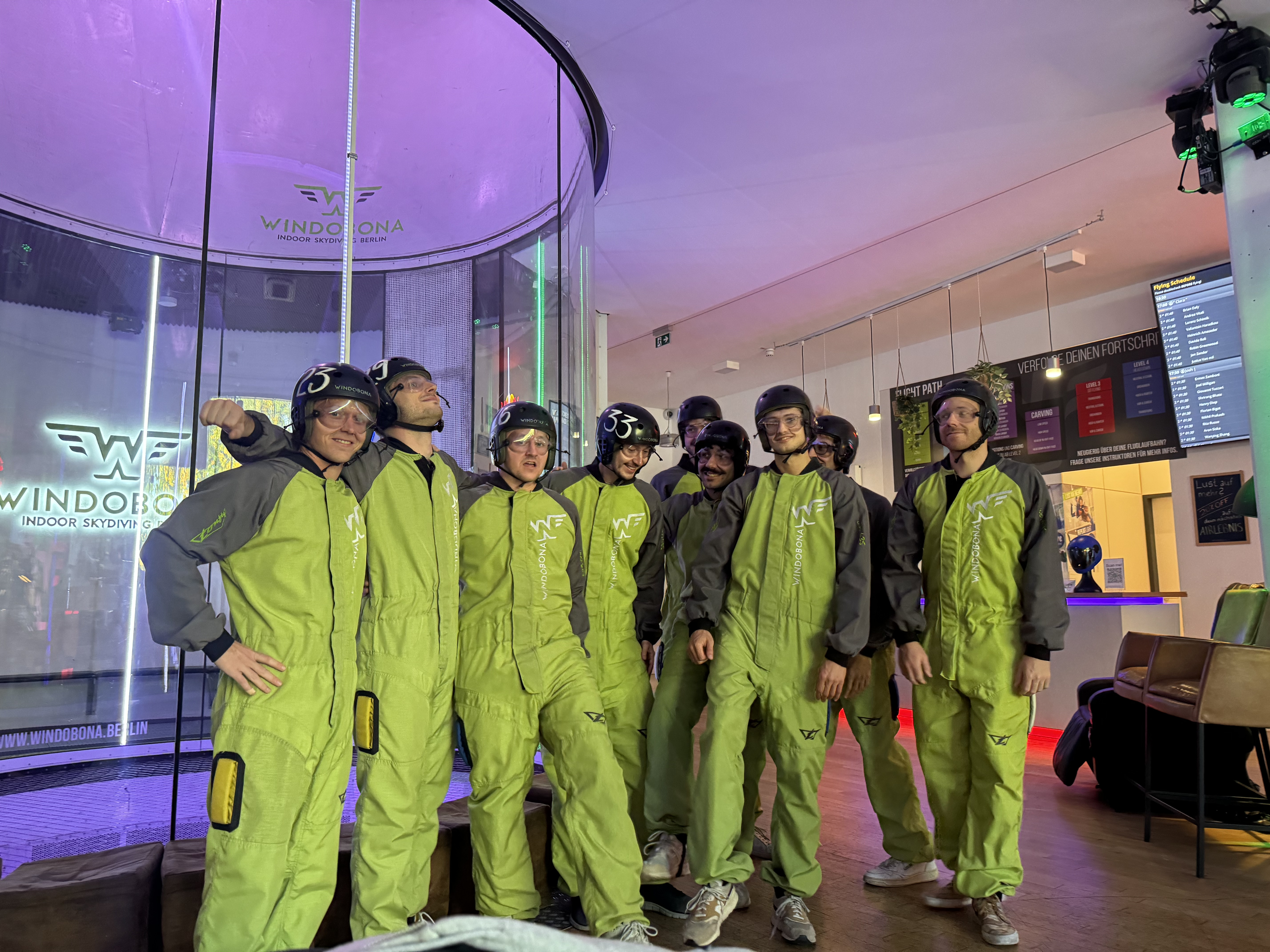 The cohort in green flight suits at Windobona indoor skydiving in Berlin